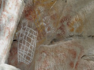 Stencil art - net, hands, stone axe