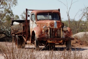 Many old trucks and utes are scattered around the opal fields